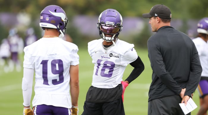 Jul 28, 2022; Minneapolis, MN, USA; Vikings head coach Kevin O’Connell and wide receivers Justin Jefferson (18) and Adam Thielen (19) talk during training camp at TCO Performance Center.